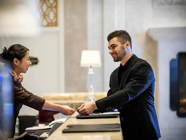 Is it okay to sneak someone else in when you travel and check into a hotel? It’s not what it looks like!